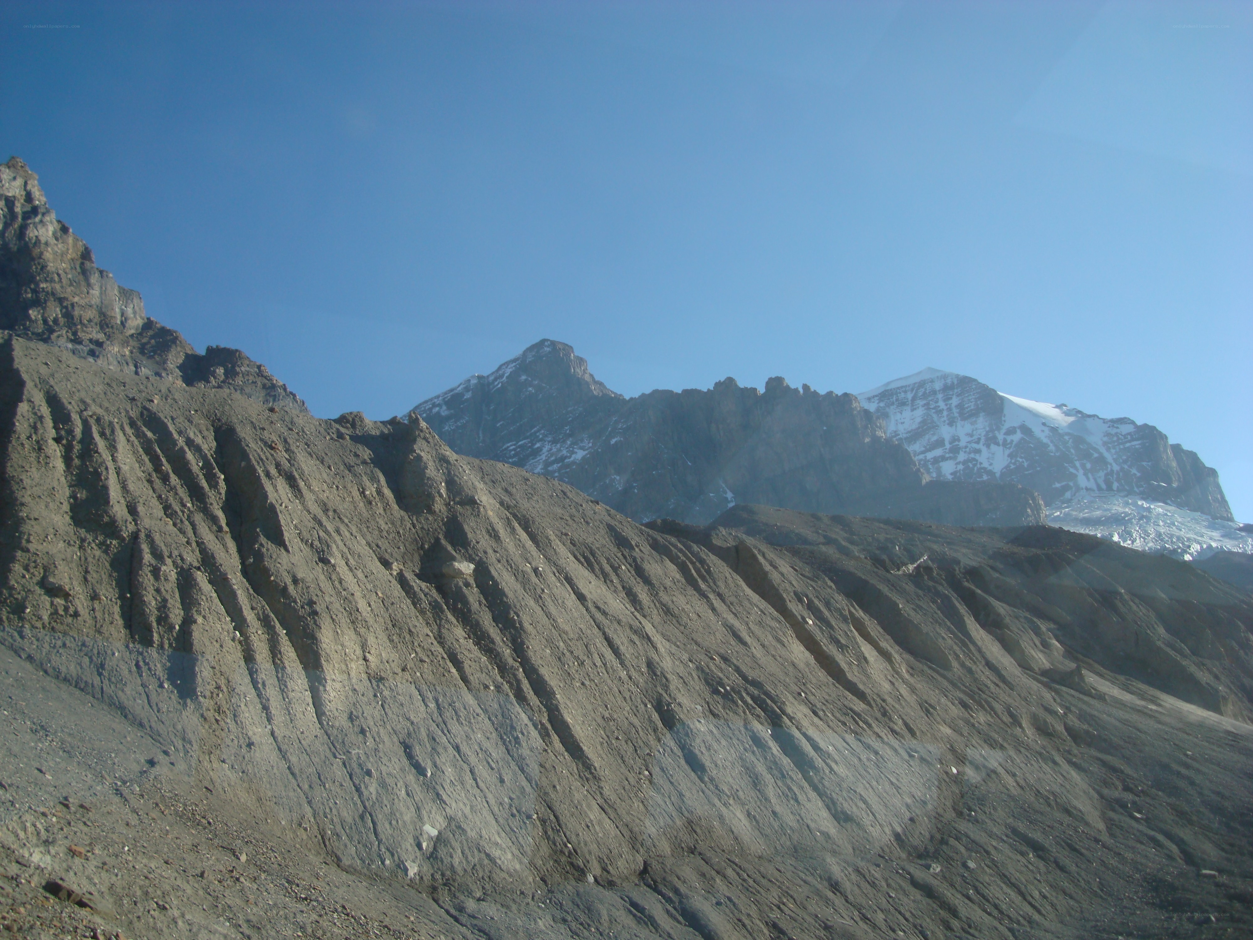 snow-capped mountains under blue sky
