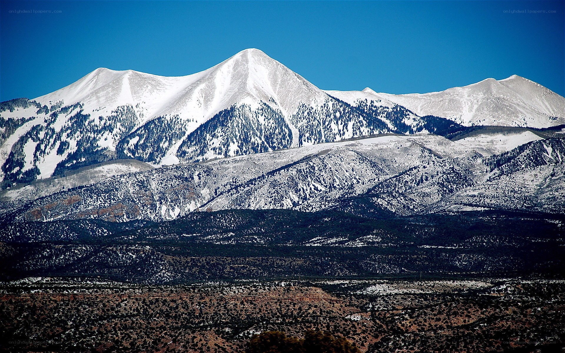 snow-capped mountains under blue sky