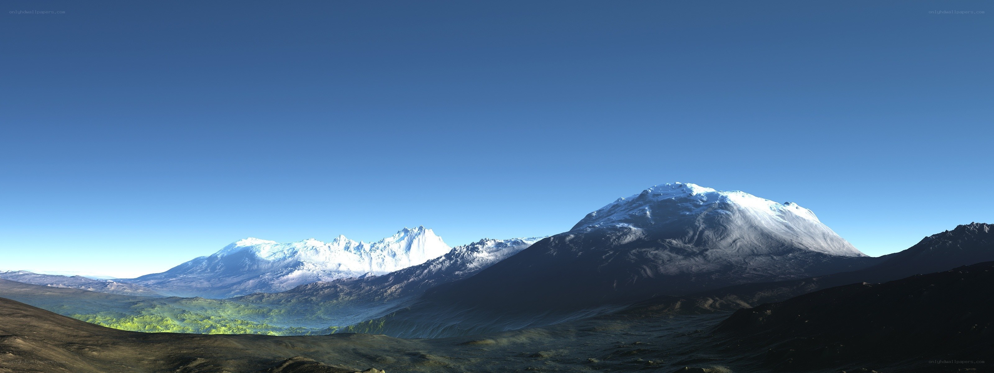 snow-capped mountains under blue sky