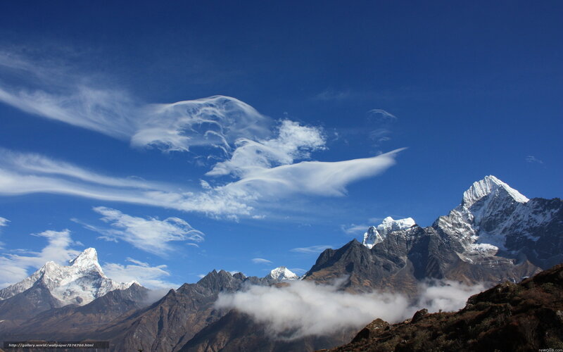 Snow-capped mountains under blue sky