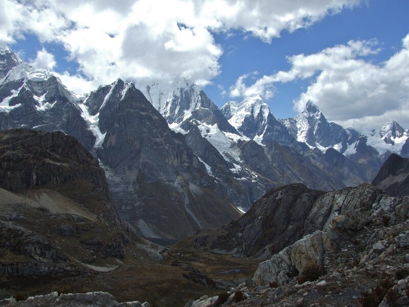 snow-capped mountains under cloudy sky