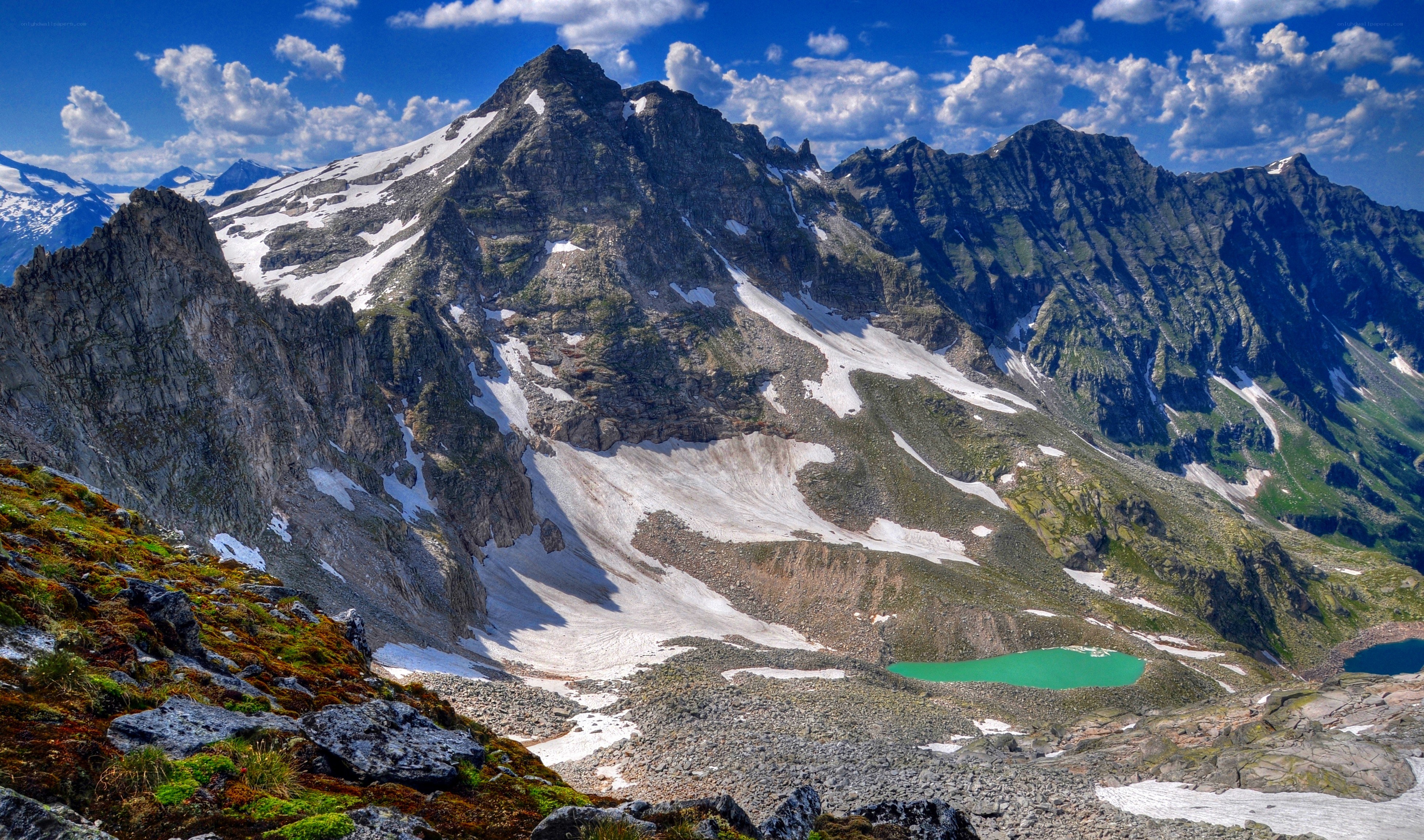 Snow-capped mountains with alpine lake