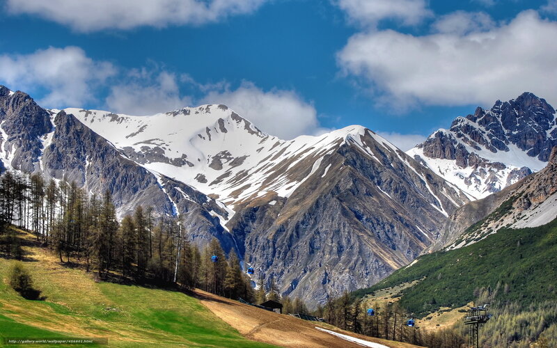 Snow-capped mountains with cable cars