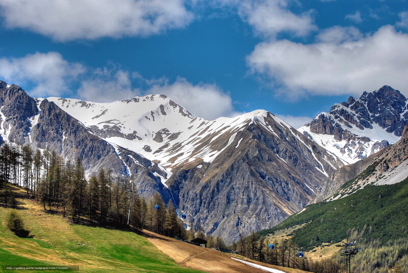 Snow-capped mountains with cable cars