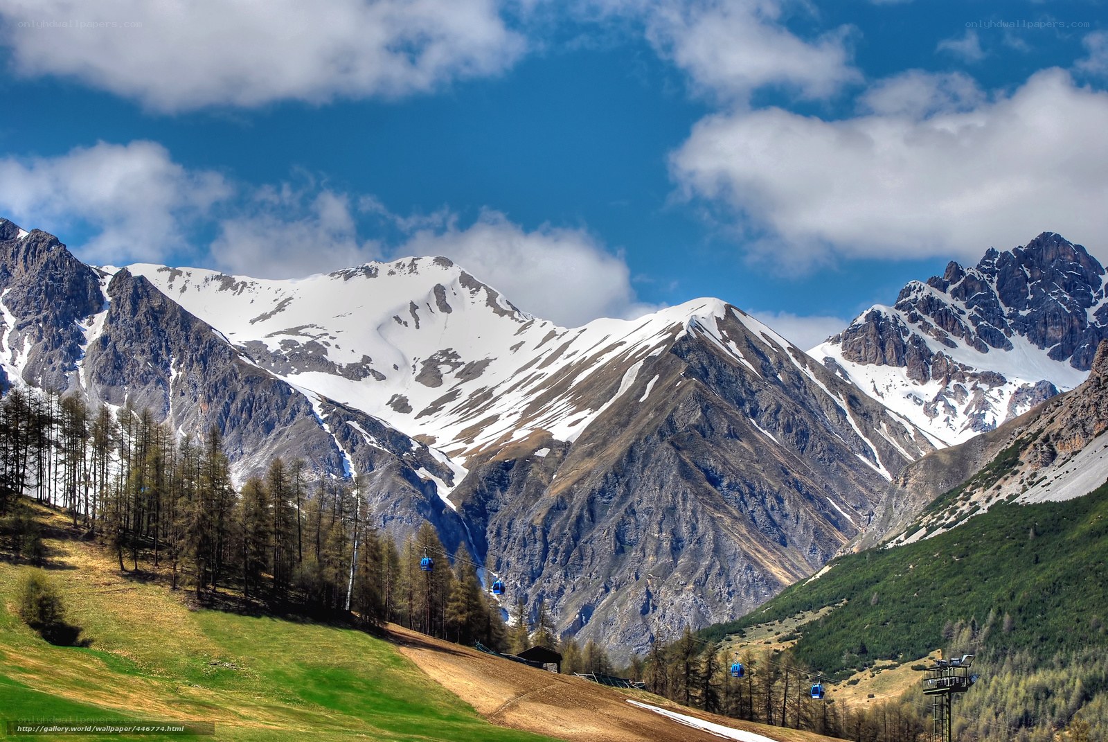 Snow-capped mountains with cable cars