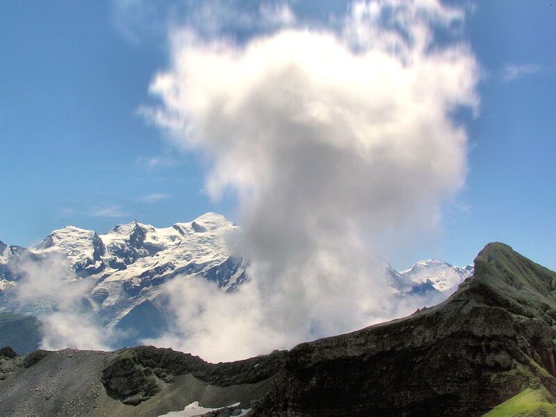 Snow-capped mountains with clouds