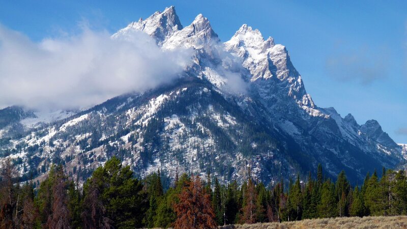snow-capped mountains with clouds