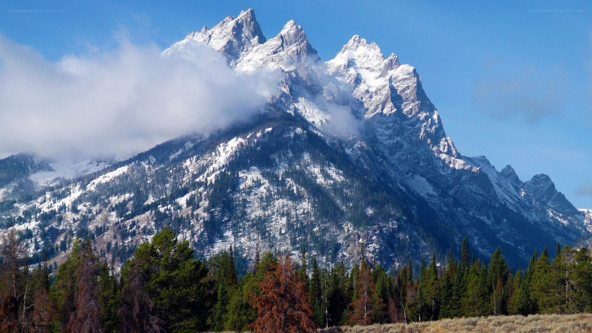 snow-capped mountains with clouds