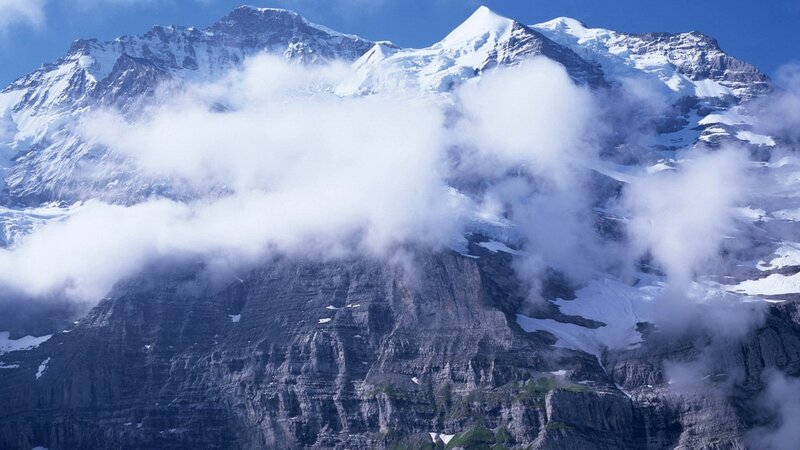 Snow-capped mountains with clouds