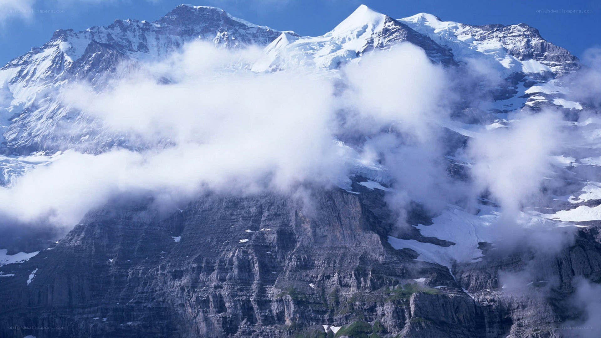 Snow-capped mountains with clouds