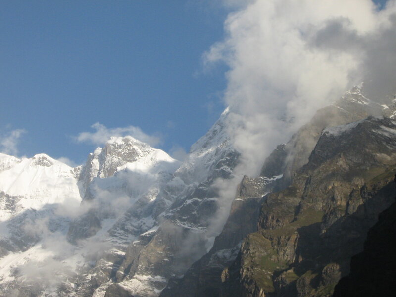 Snow-capped mountains with clouds