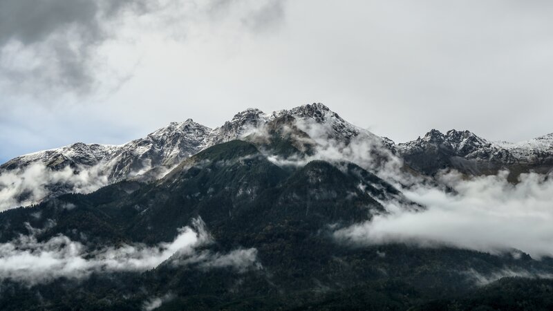 Snow-capped mountains with clouds