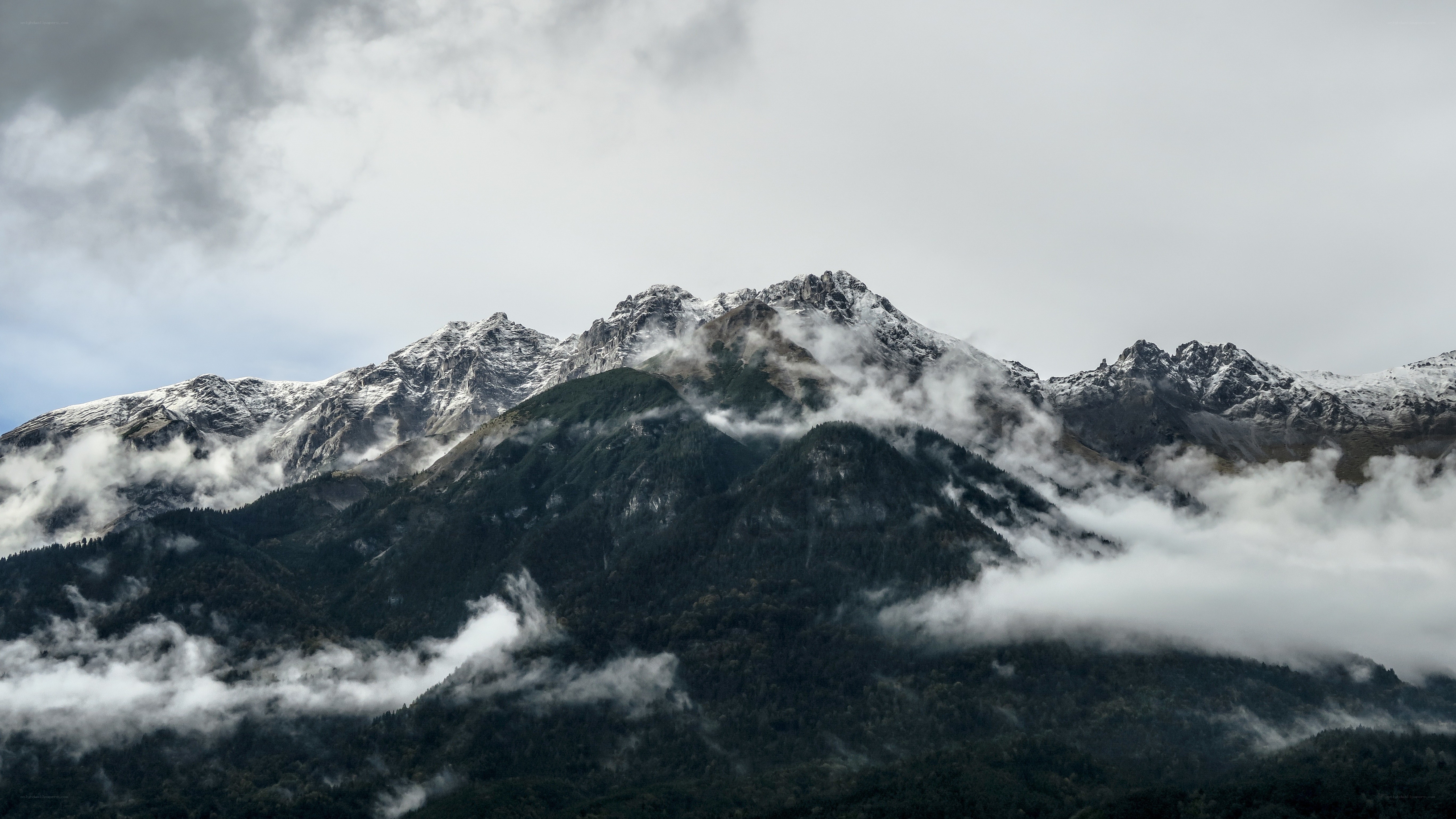 Snow-capped mountains with clouds