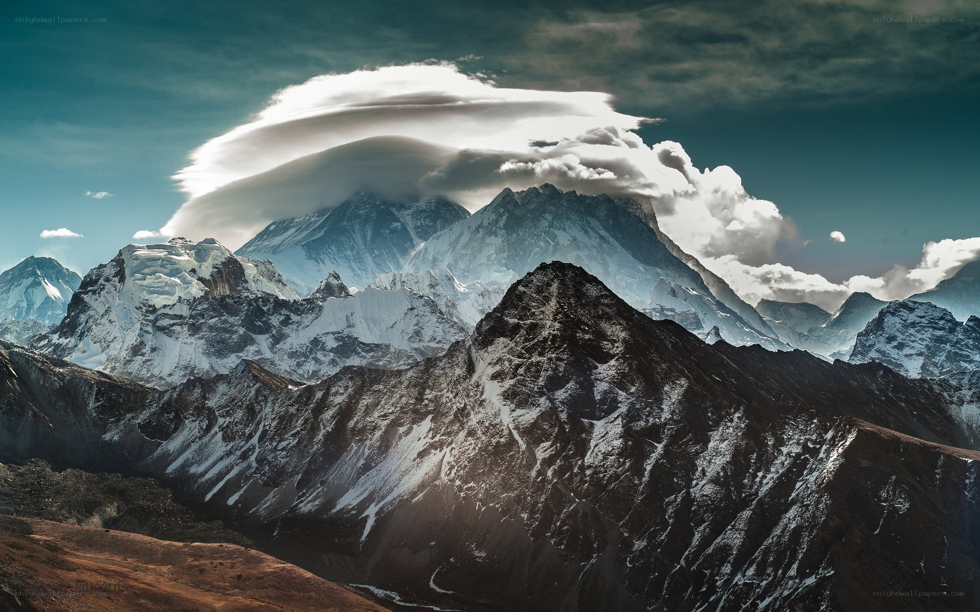 Snow-capped mountains with lenticular cloud