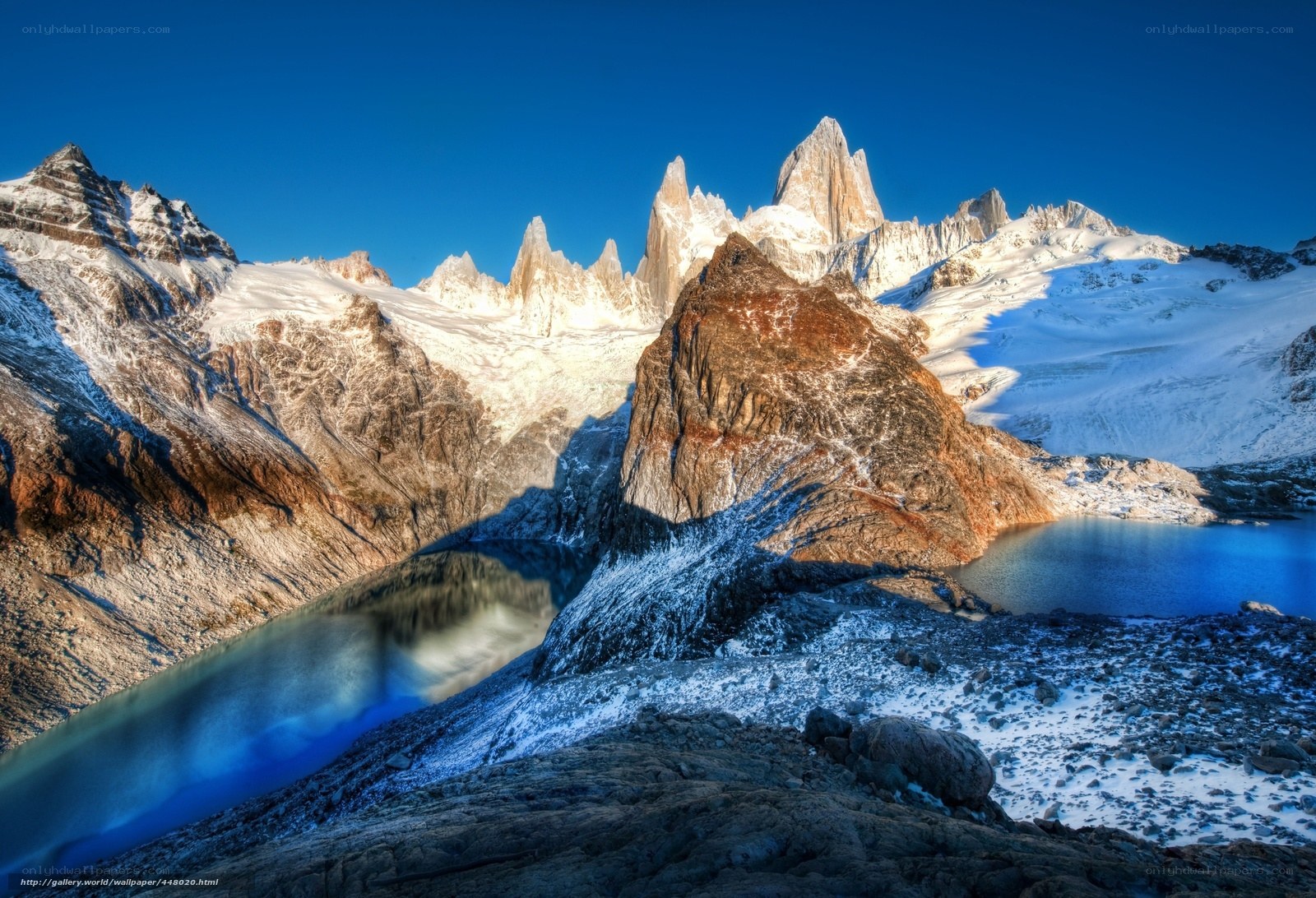 Snow-capped peaks and alpine lake