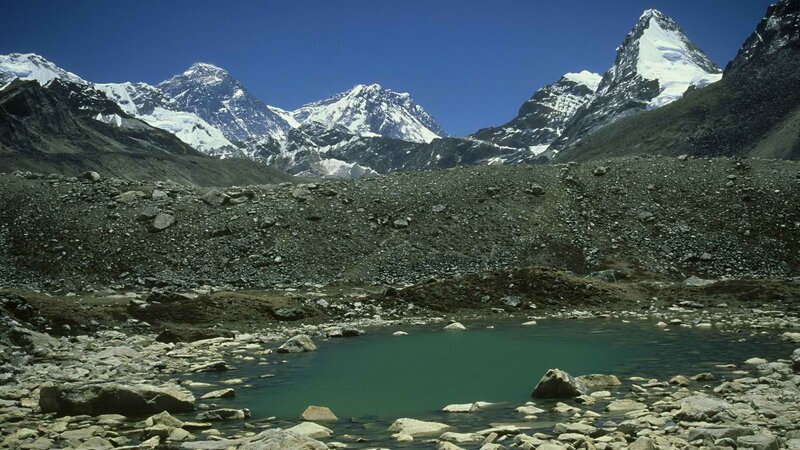 Snow-capped peaks and alpine lake