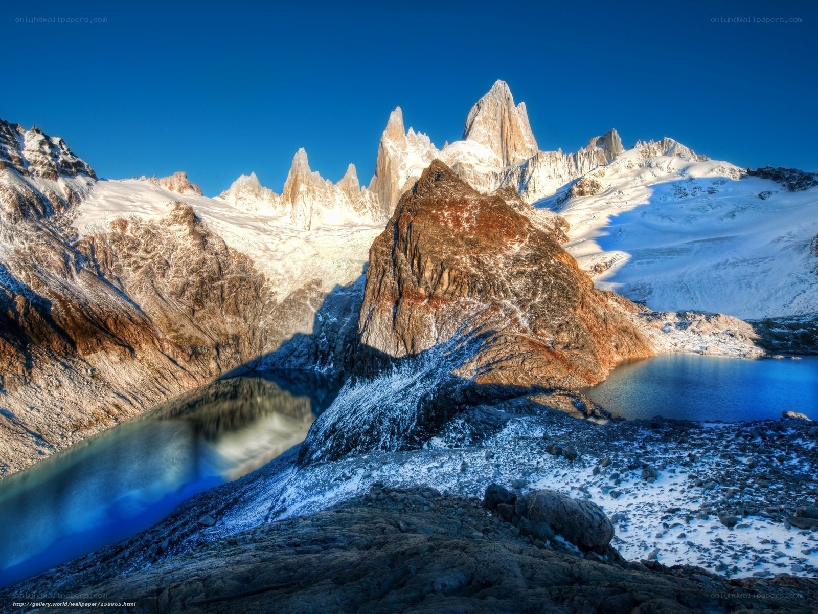 Snow-capped peaks and alpine lake