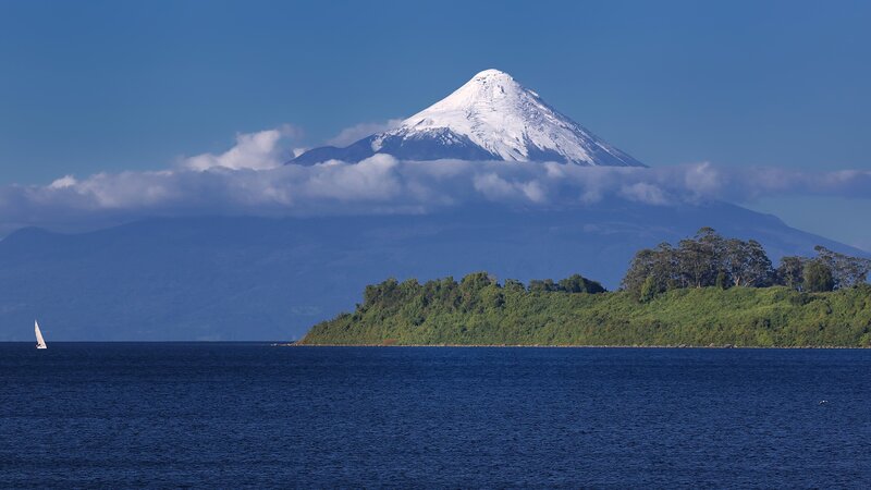Snow-capped Volcano — Blue, Serene, Afternoon, Photograph, Sailboat