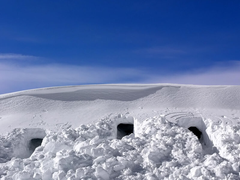Snow caves on a snowy hill