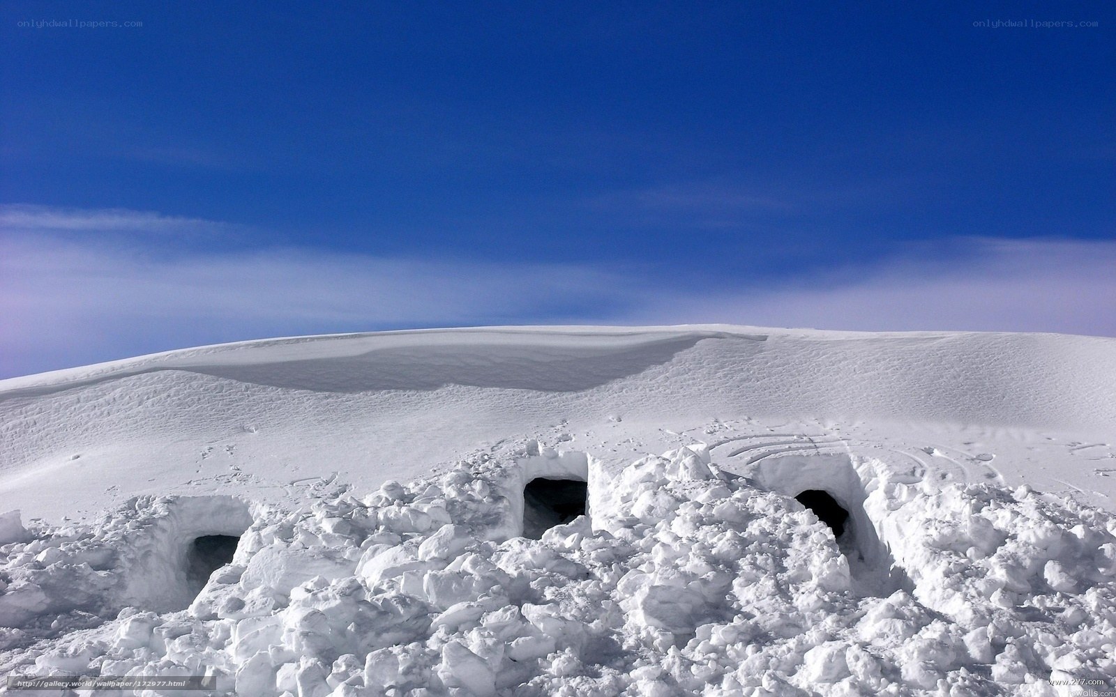 Snow caves on a snowy hill
