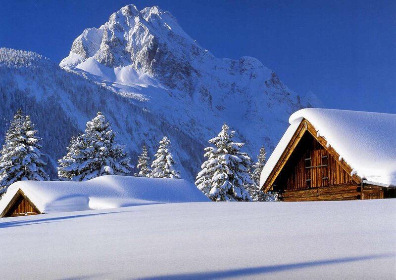 Snow-covered Alpine Cabin