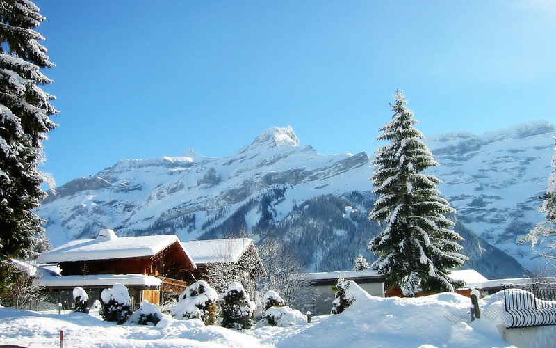 Snow-covered Alpine Village — Blue