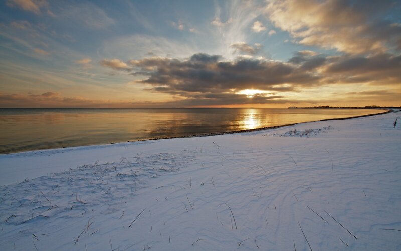 Snow-covered Beach at Sunset
