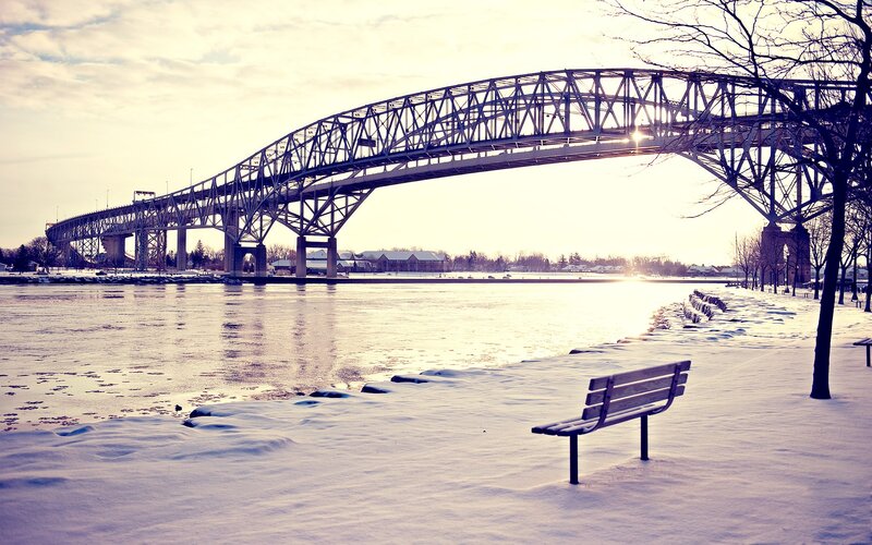 Snow-covered Bench by Bridge — White