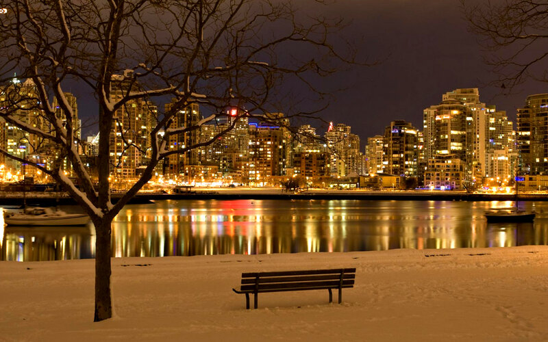 Snow-covered Bench by Water