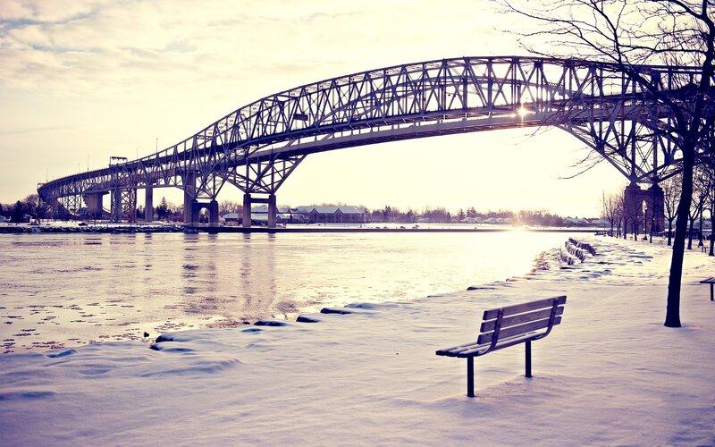 Snow-covered Bench under Bridge — White