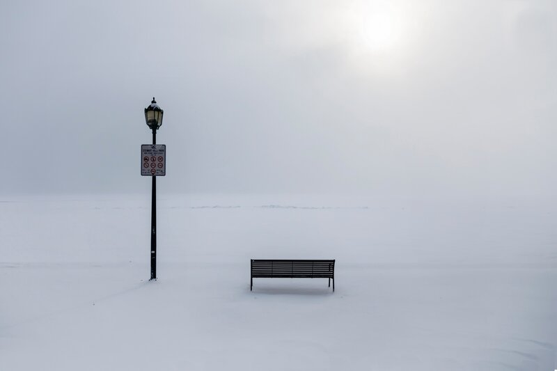 Snow-covered Bench — White, Desolate