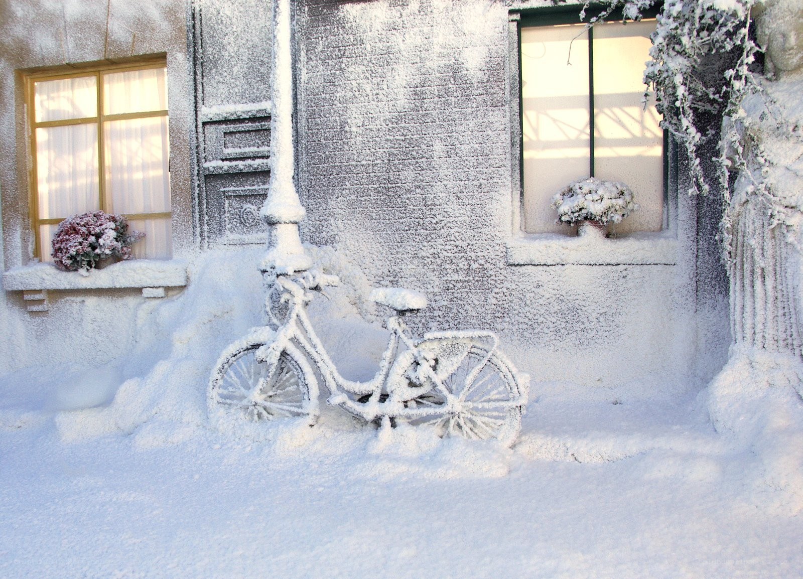 Snow-covered bicycle in winter