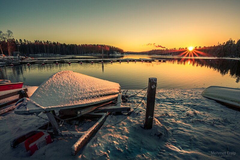 Snow-covered Boat at Sunset