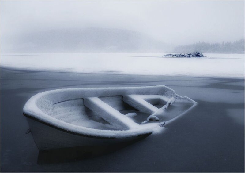 Snow-covered Boat on Ice
