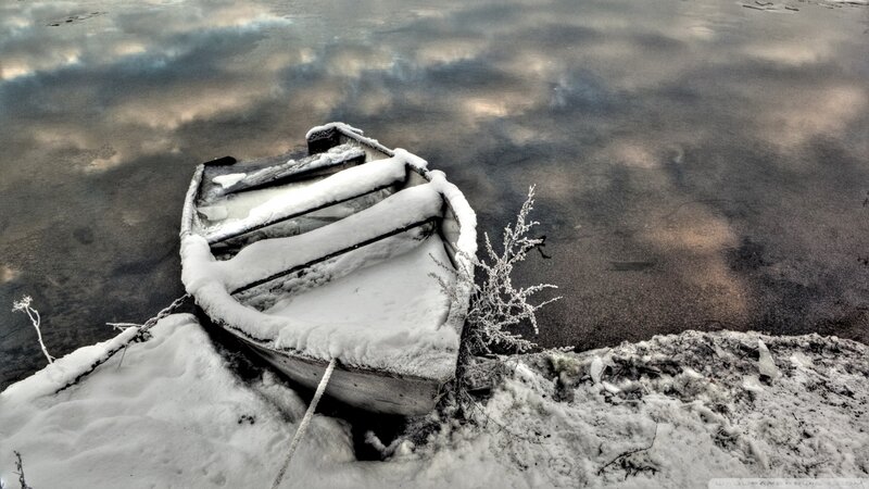 Snow-covered Boat on Shore