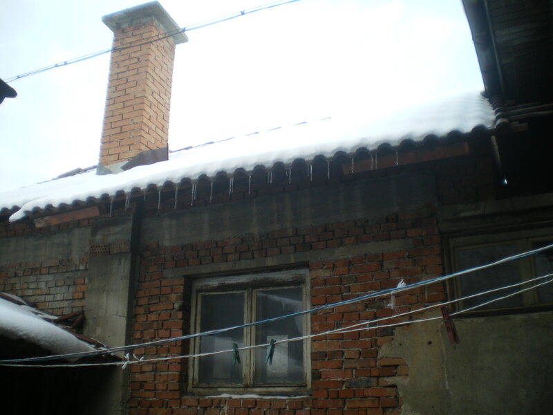 Snow-covered Brick Building — Red