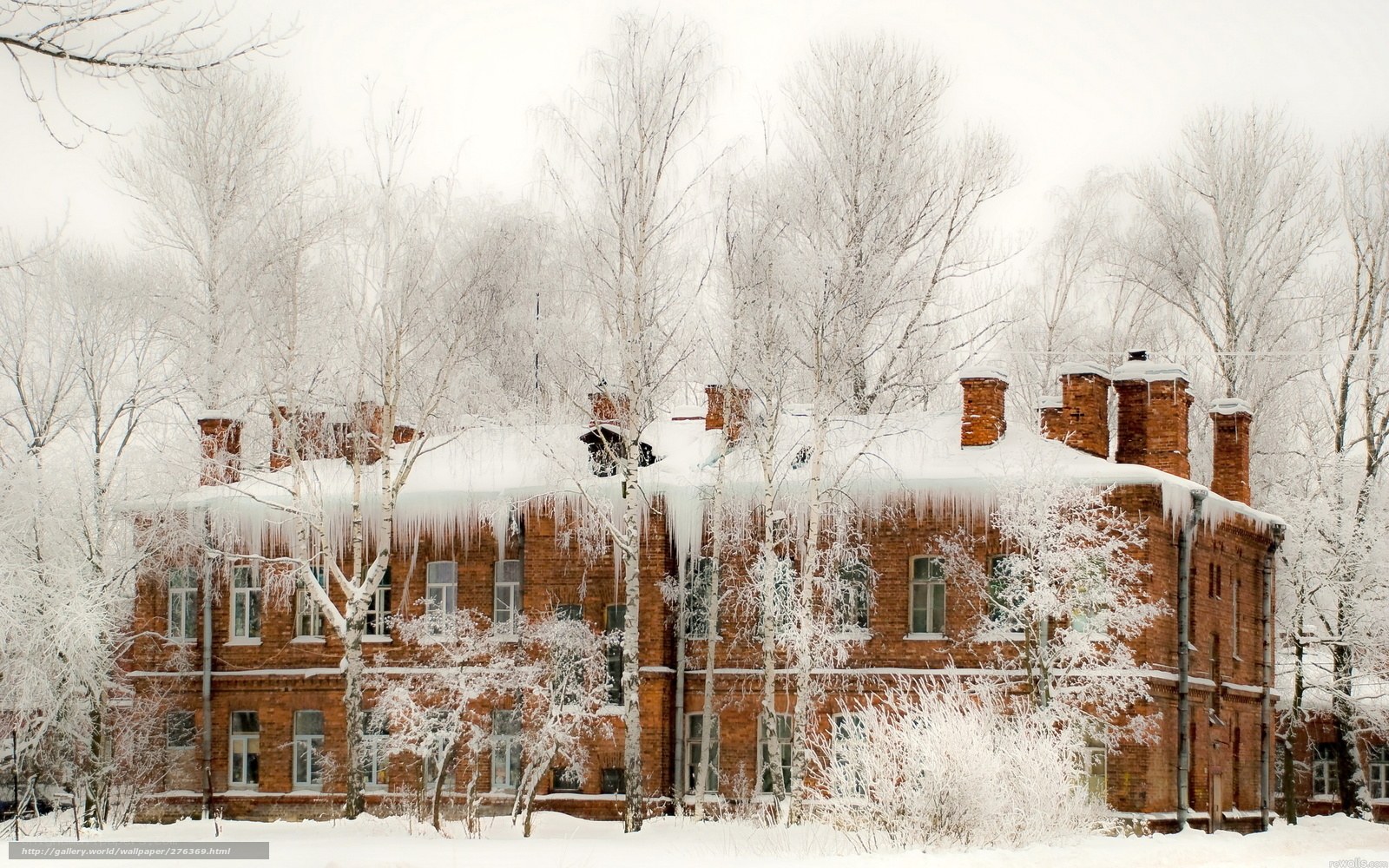 Snow-covered brick building