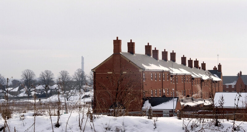 Snow-covered brick houses in winter