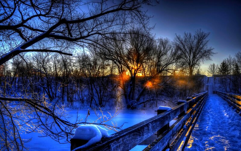 Snow-covered Bridge at Sunset