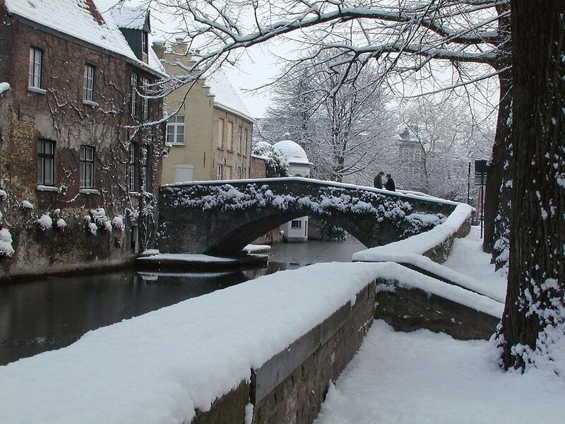 Snow-covered Bridge in Canal