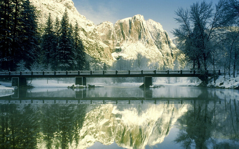 Snow-covered Bridge in Valley