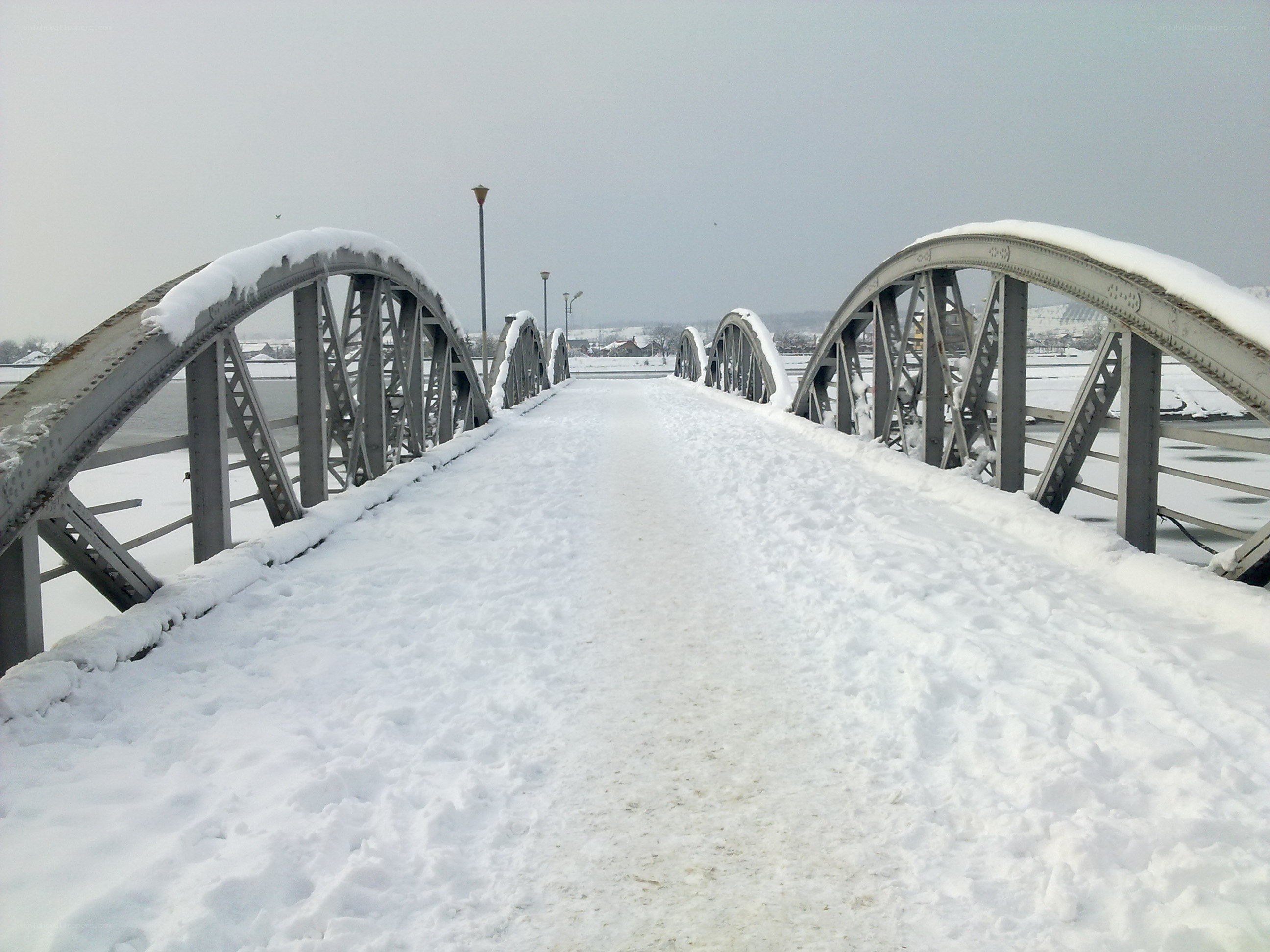 Snow-covered bridge in winter