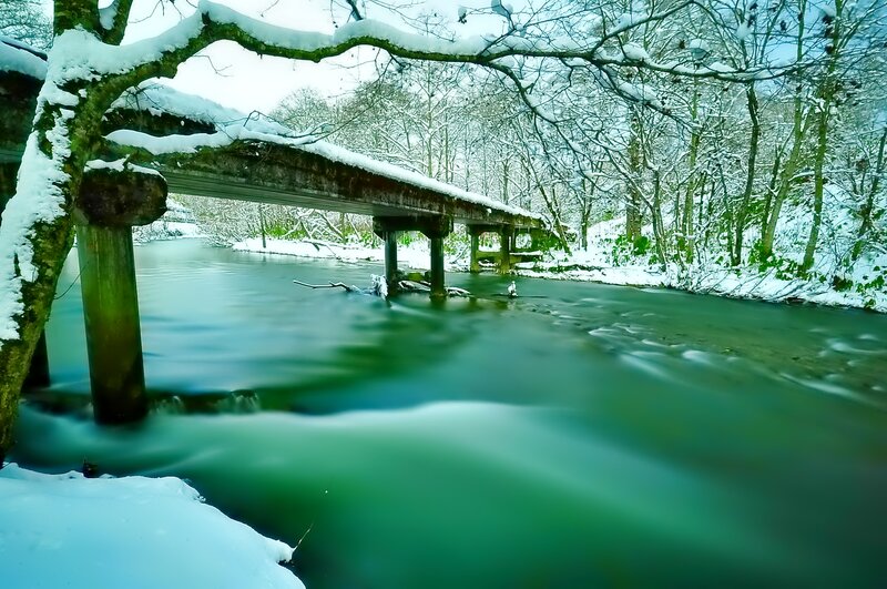 Snow-covered Bridge over River — Green