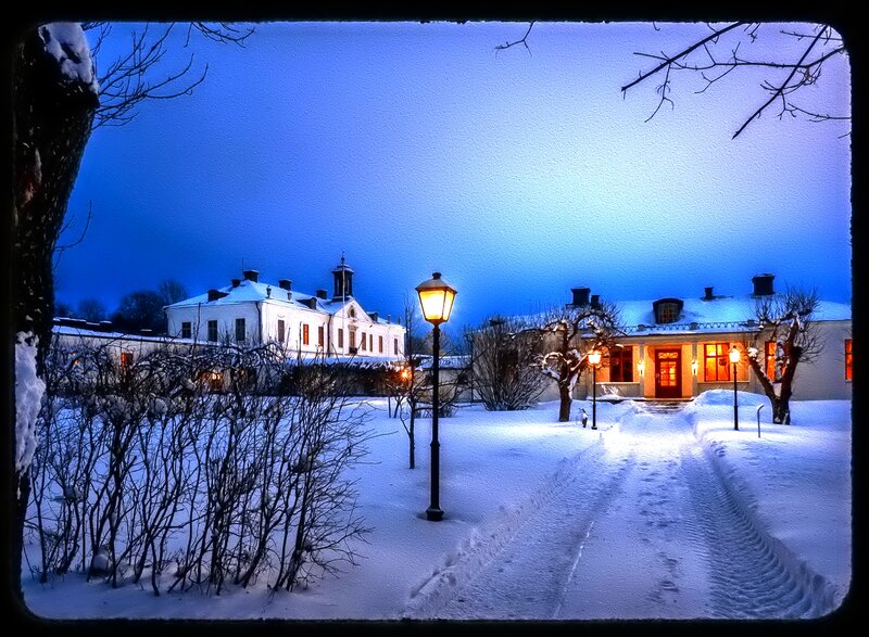Snow-covered Buildings at Night