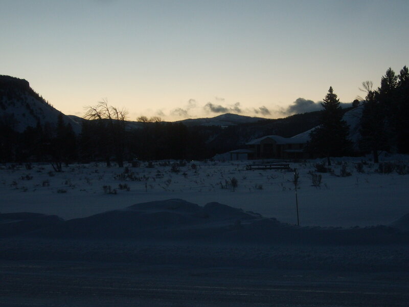 Snow-covered Cabin at Dusk