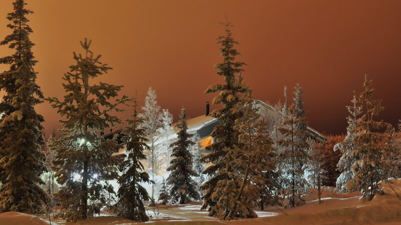 Snow-covered Cabin at Night — Orange