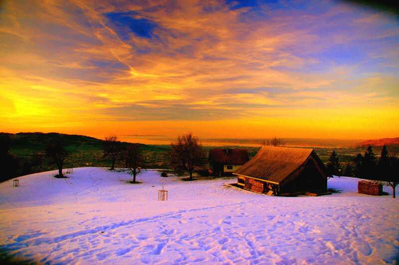 Snow-covered Cabin at Sunset — Orange