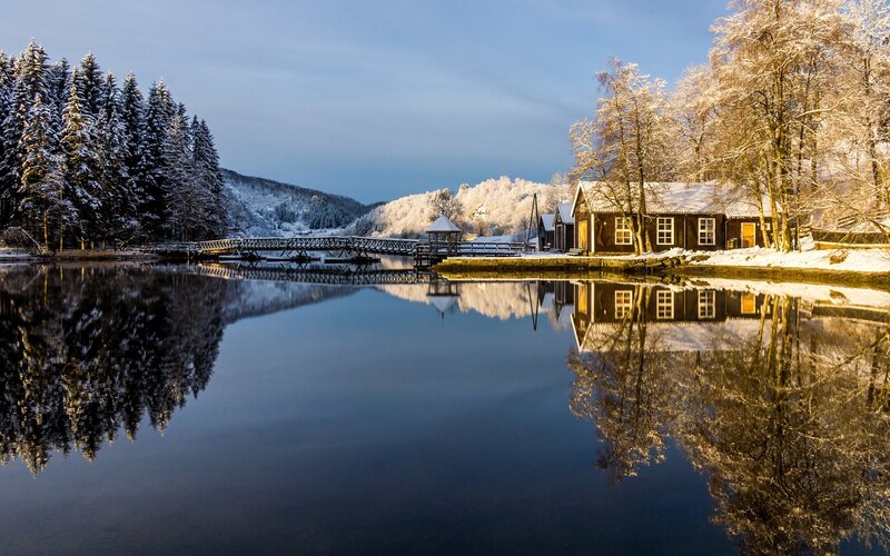 Snow-covered Cabin by Lake — Blue, Serene, Winter, Photograph, Bridge