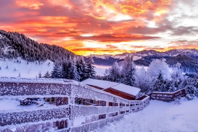 Snow-covered Cabin in Mountains — Orange