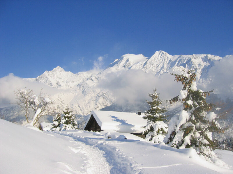 Snow-covered Cabin in Mountains — White